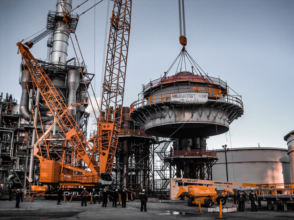 crane lifting a FCCU regenerator head in a refinery